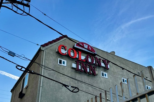 Old, faded channel letters on the Colony Inn building in North Hollywood need sign retrofits.