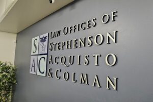 Angled right view of lobby sign for Law Offices of Stephenson, Acquisto & Colman.