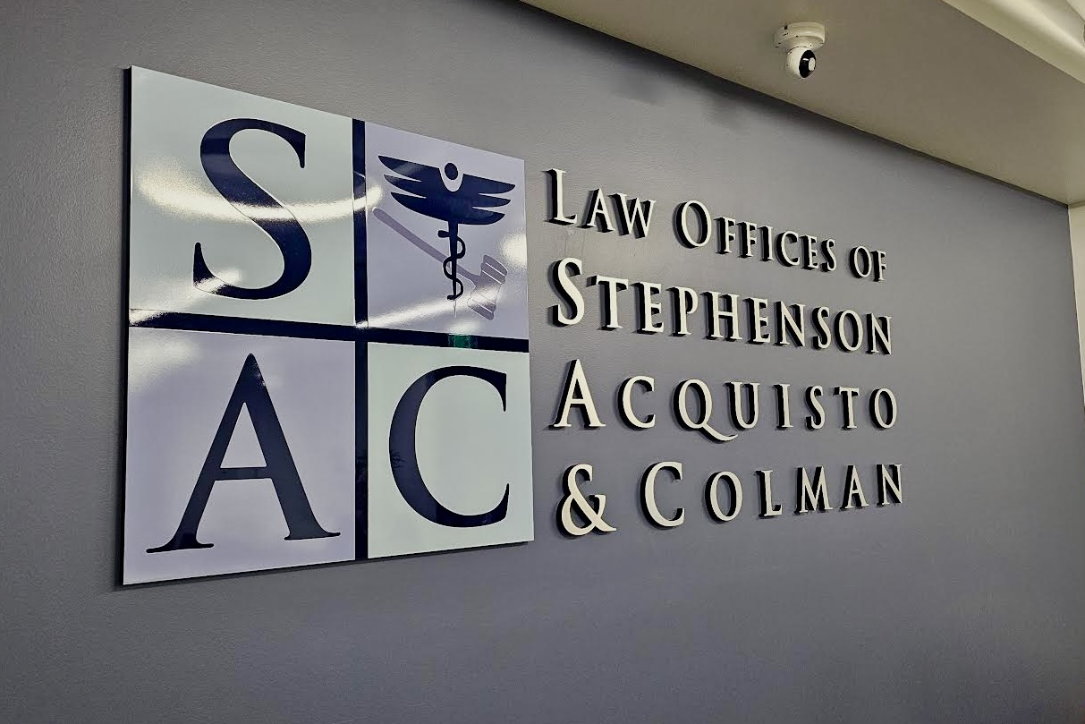 Angled left view of lobby sign for Law Offices of Stephenson, Acquisto & Colman.