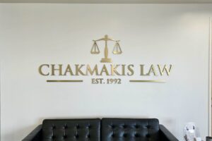 Chakmakis Law firm’s golden lobby sign