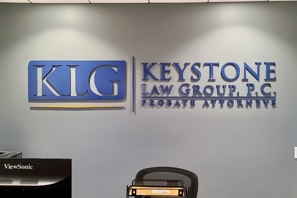 Lobby sign for Keystone Law Group with blue acrylic letters by Los Angeles sign maker Premium Sign Solutions.