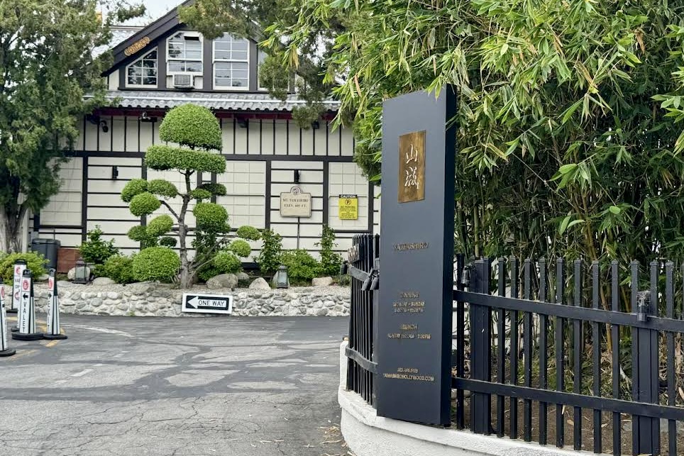 Monument sign for Yamashiro Hollywood with intricate traditional Japanese design elements.