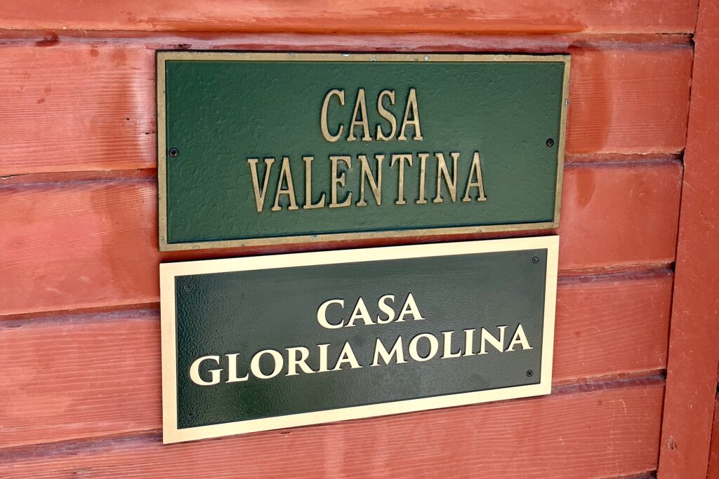 Close-up of the Casa Molina bronze plaque in Oxnard, showcasing engraved copy, raised lettering, and brushed finish.
