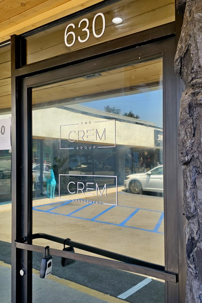 The Crem Group logo displayed on the glass door at their Burbank office.