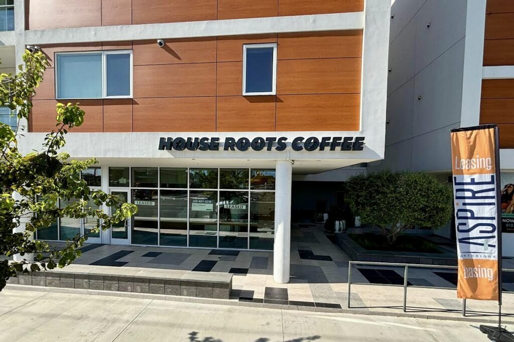 Wide angel view of House Roots Coffee's elegant black channel letters, highlighting the premium construction and refined aesthetic that appeals to Northridge's discerning clientele.