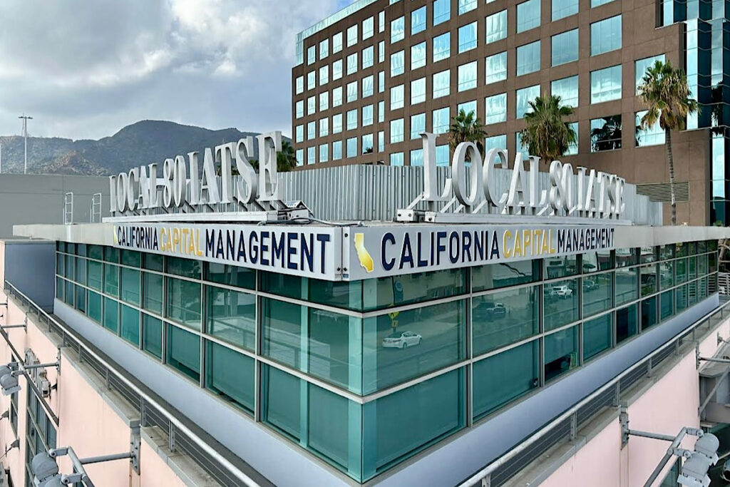 A  view of the back of the California Capital Management illuminated sign. The image shows the sign features silver metallic lettering pushed through a white acrylic face.