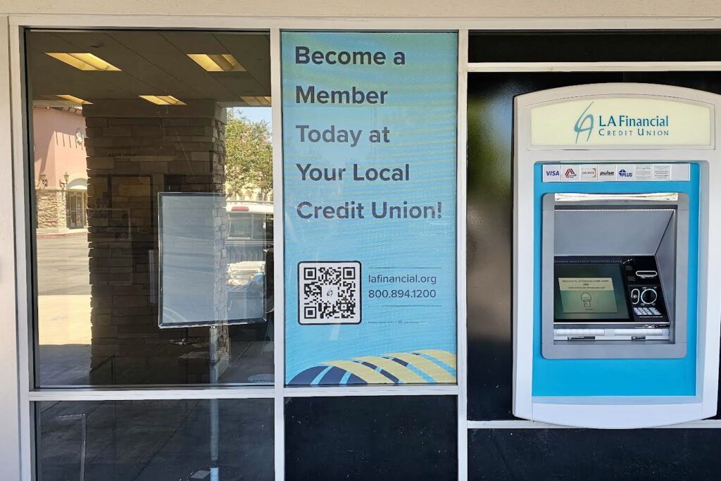 A detailed view of one of LA Financial's side window displays in Norwalk. The matte finish and perforated material ensure visibility into the branch while presenting the custom imagery on the exterior.
