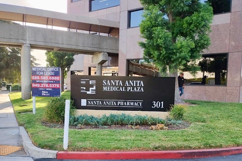 Wide shot of the Santa Anita Medical Plaza monument sign, showcasing its prominent placement and how it enhances the building's overall aesthetic.