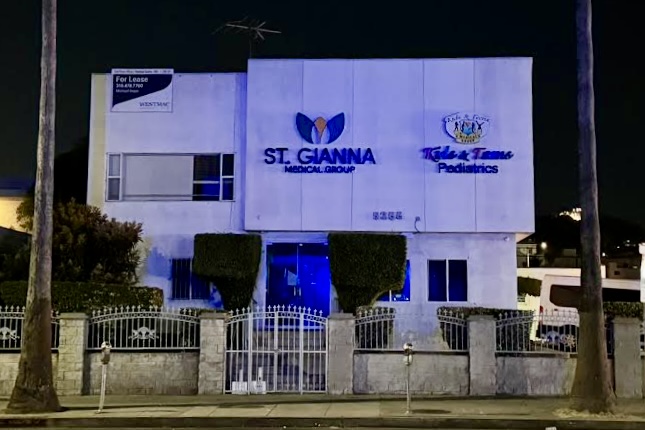 Dusk shot of illuminated channel letter signs for St. Gianna Medical Group and Kids & Teens Pediatrics in Los Angeles.