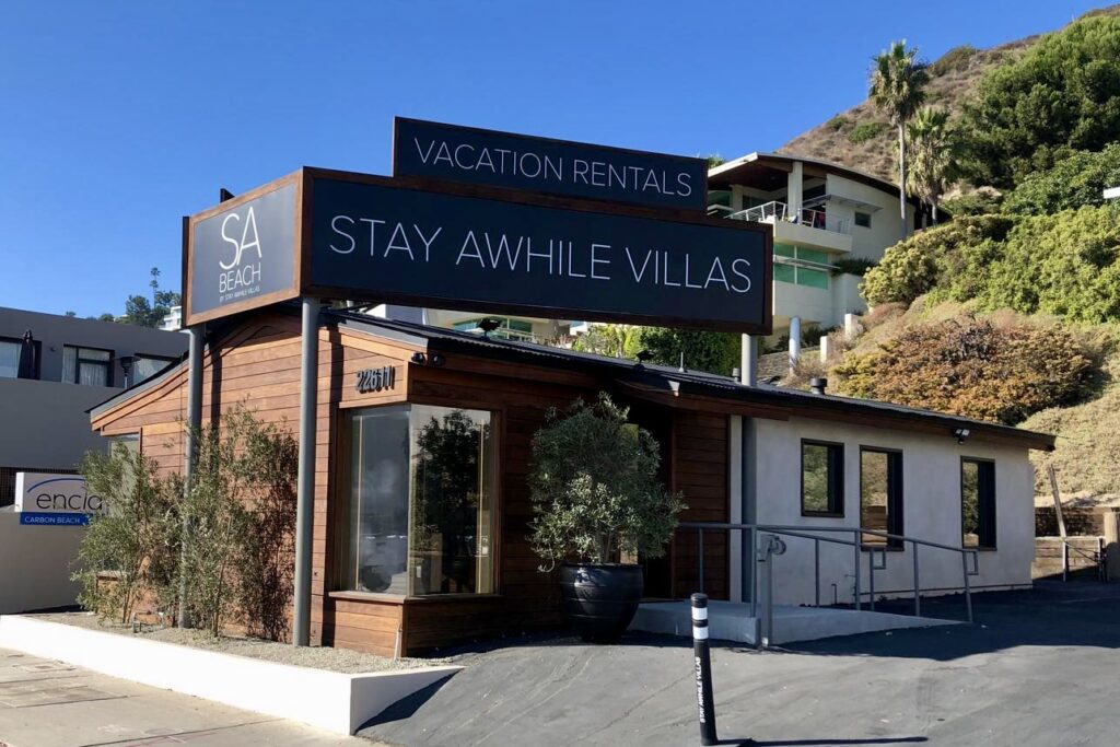 Full view of Dibond exterior weatherproof hotel sign at Stay Awhile’s luxury extended-stay property