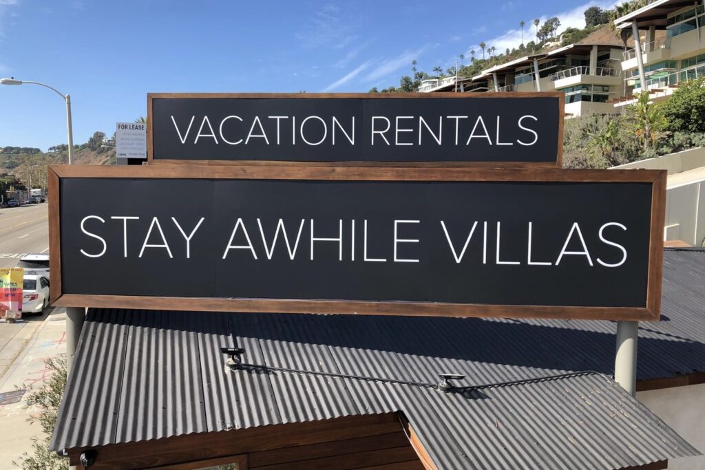 Dibond exterior signage installed at Stay Awhile Malibu, showcasing a sleek modern look
