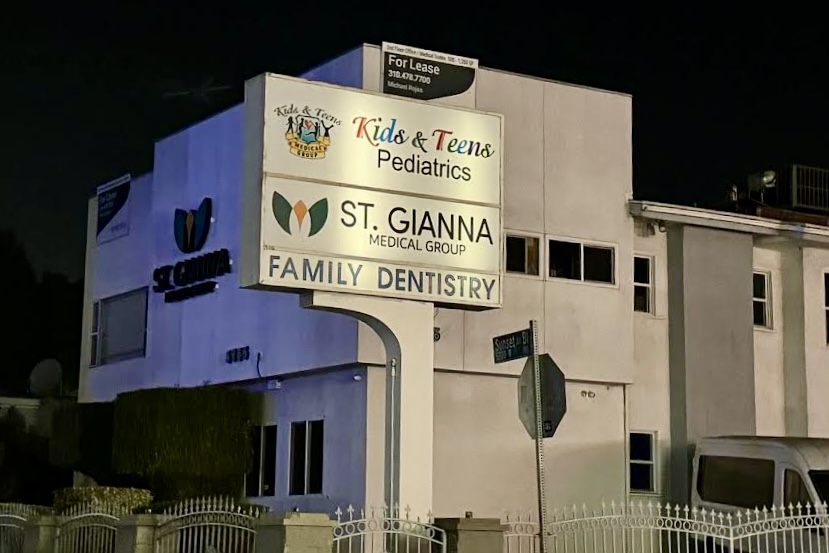 Dusk shot of a custom pole sign for St. Gianna Medical Group and Kids & Teens Pediatrics, showcasing vibrant colors and durability.