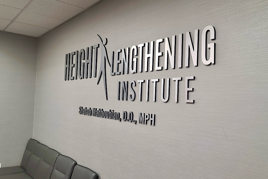 Photo of the brushes metal lobby sign at the Height Lengthening Institute. Medical marketing that shows prestige and professionalism. 