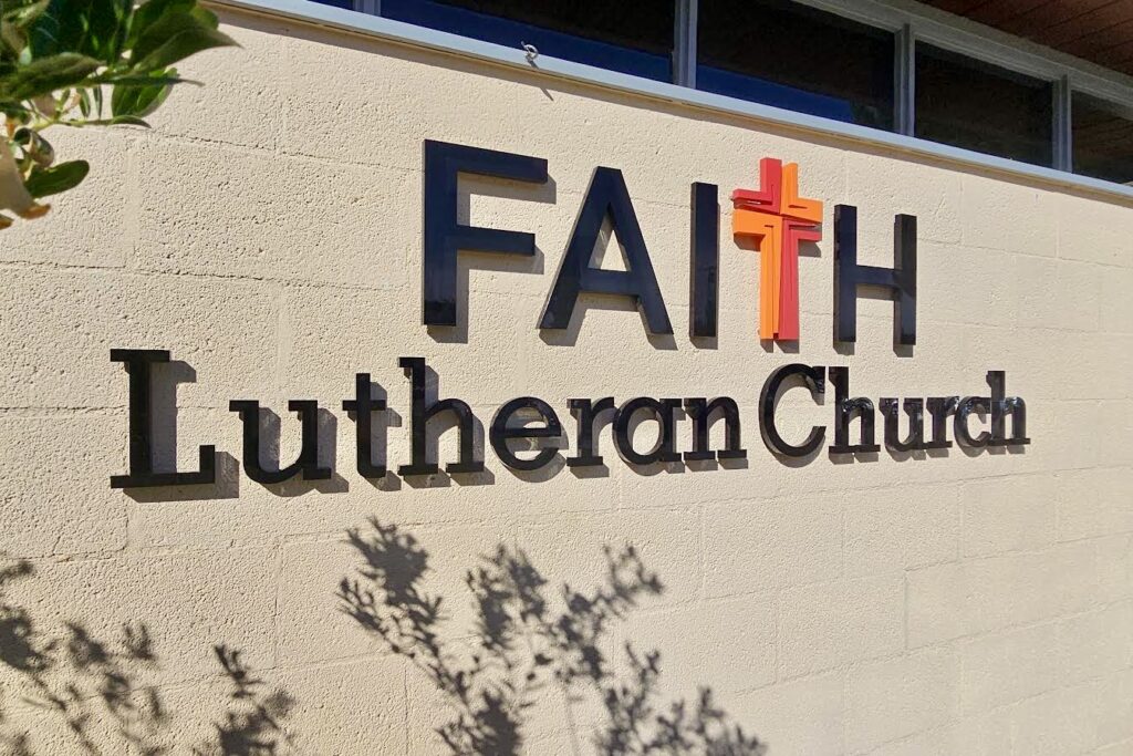 Faith Lutheran Church's dimensional letter signage, showcasing the full sign and its prominent placement on the building.  The image emphasizes the clean lines and professional look of the acrylic letters.