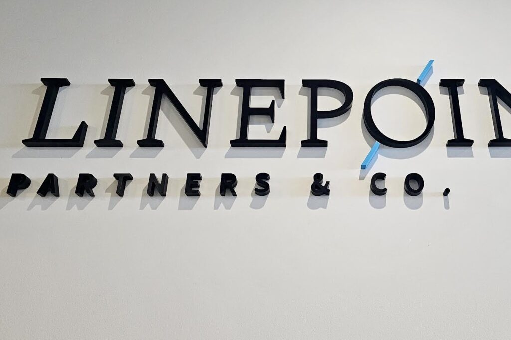 A professional office sign - we made a dimensional lobby sign for Linepoint Partners & Co. in Century City with bold black letters and a modern blue accent.