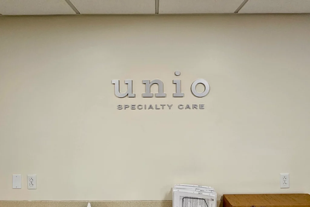 Healthcare office signage in Downey waiting area at Unio Healthcare