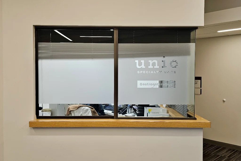 Install view of frosted vinyl privacy signage at Unio Pasadena medical office