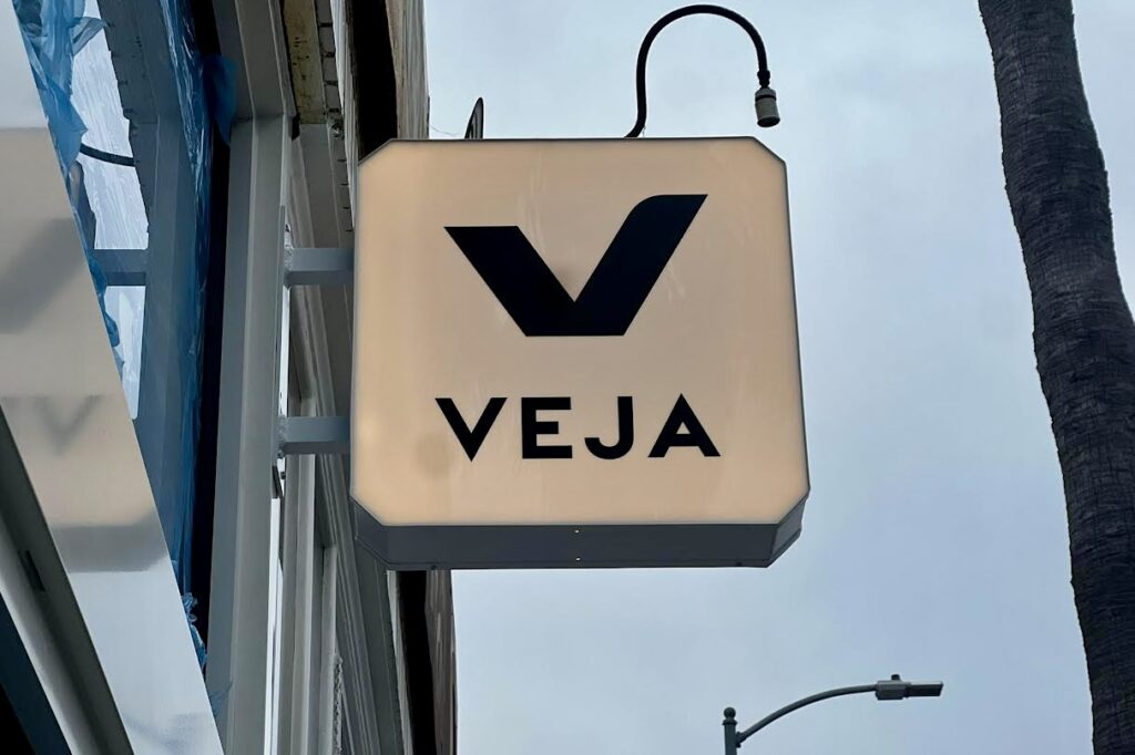 This is the Veja Venice store blade sign nearly above their entrance outside. This is part of their retail signage package.