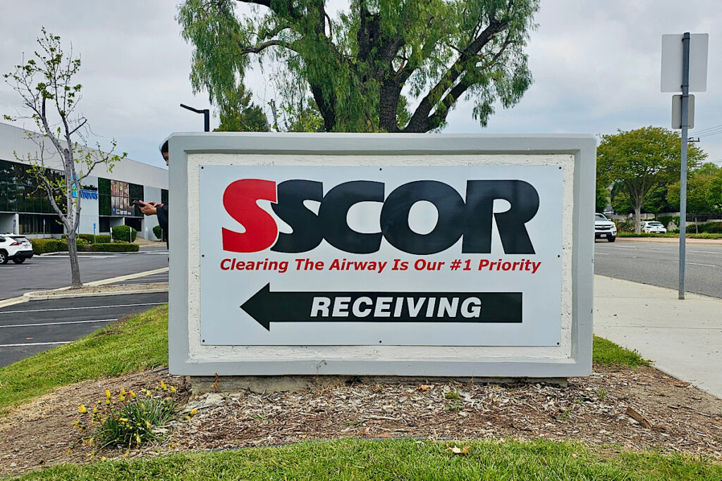 Professional monument wayfinding sign insert with SSCOR branding for medical manufacturing property