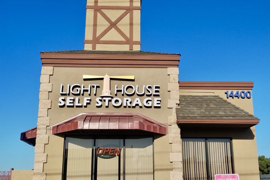 The main building channel letters sign with a brightly lit lighthouse.