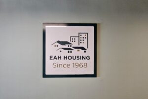 Read more about the article Layered Acrylic Office Sign EAH Housing Burbank