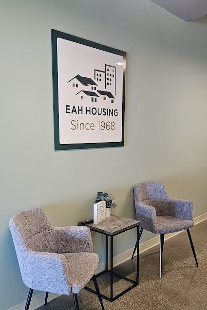 EAH Housing acrylic wall sign with layered panels in Burbank office
