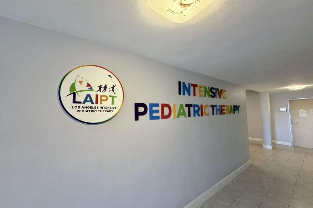 Pediatric medical office lobby signage featuring custom acrylic logo for Northridge pediatric clinic.